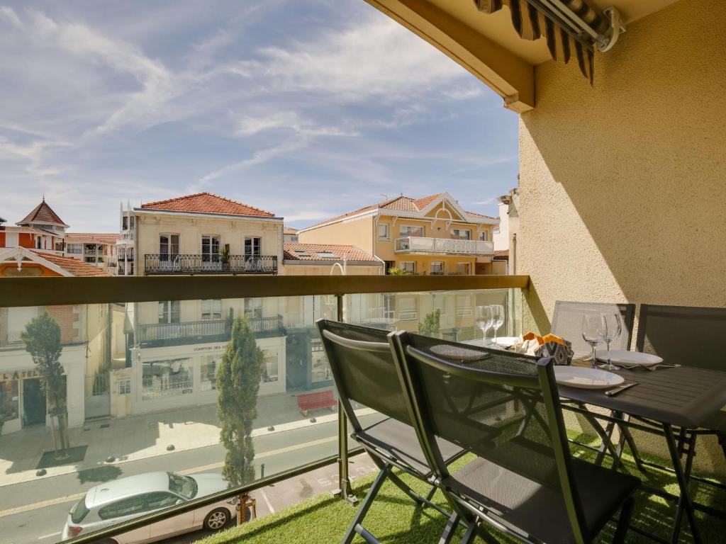 a patio with a table and chairs on a balcony at Studio Sun Beach by Interhome in Arcachon