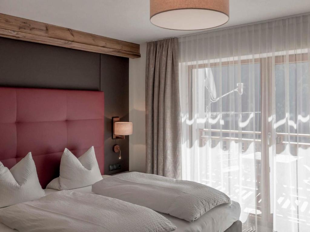 Posteľ alebo postele v izbe v ubytovaní Apartment Melisande 2 by Interhome