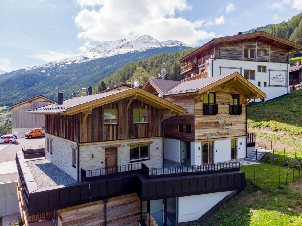 an aerial view of a house in the mountains at Holiday Home The PEAK-5 by Interhome in Sölden