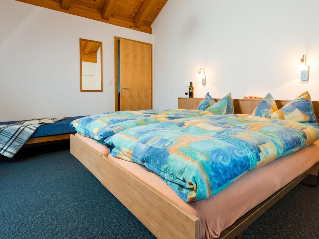 Postel nebo postele na pokoji v ubytování Chalet Piccolo by Interhome