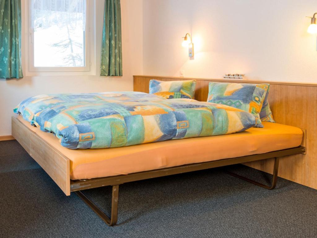 Postel nebo postele na pokoji v ubytování Chalet Piccolo by Interhome