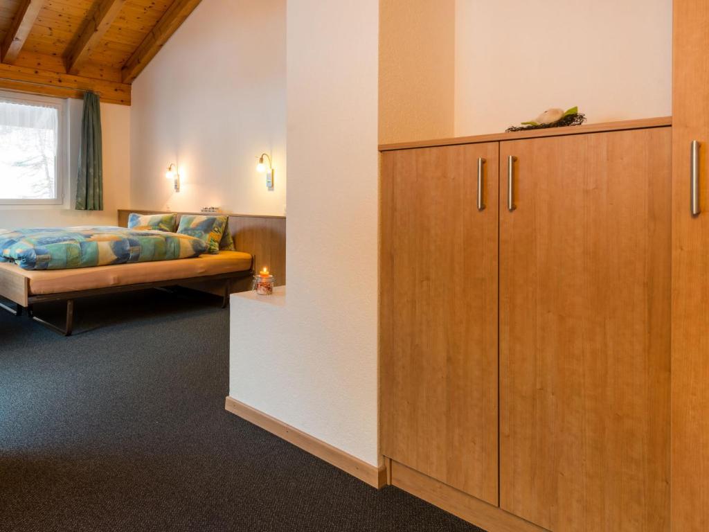 Postel nebo postele na pokoji v ubytování Chalet Piccolo by Interhome