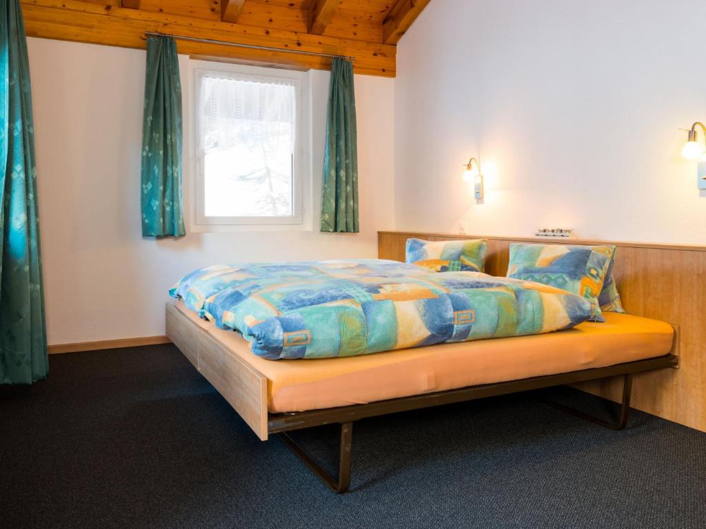 Postel nebo postele na pokoji v ubytování Chalet Piccolo by Interhome
