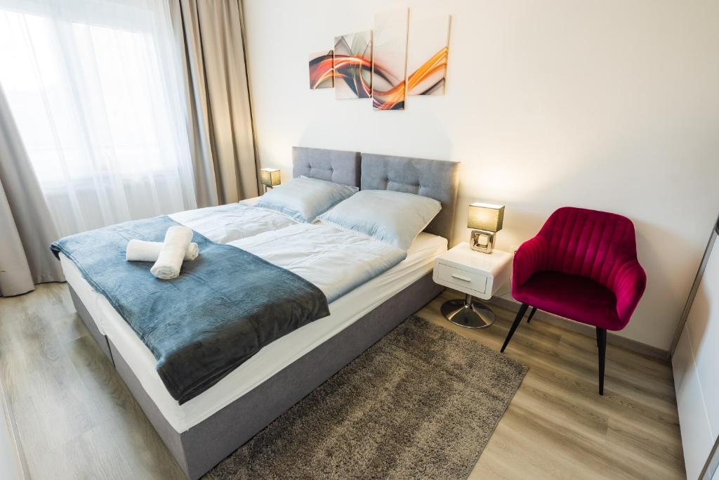 Postel nebo postele na pokoji v ubytování Central Residence