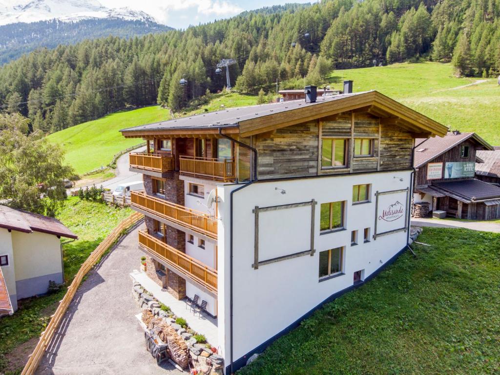an aerial view of a house in the mountains at Apartment The PEAK-3 by Interhome in Sölden