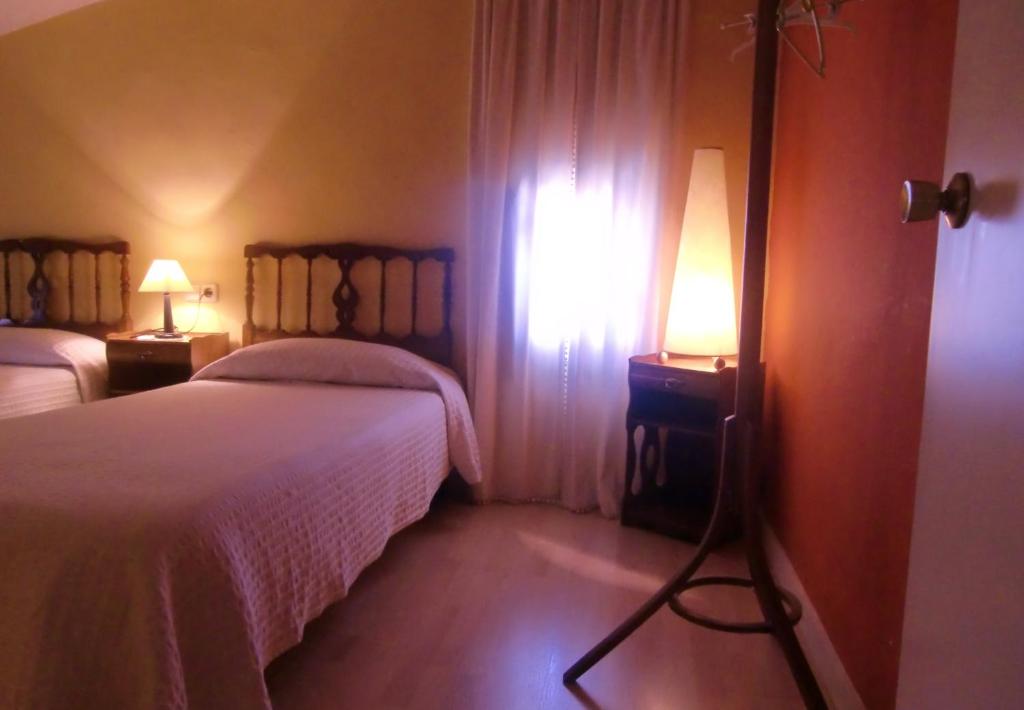 Postel nebo postele na pokoji v ubytování Casa Rural Jose Trullenque