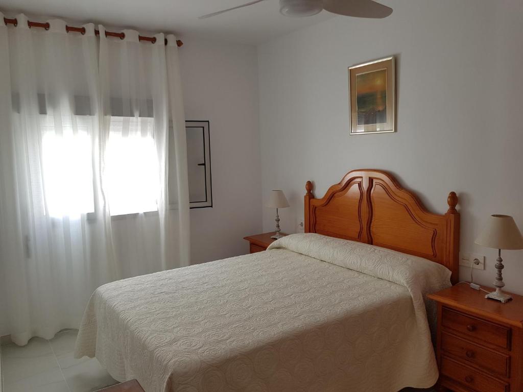 Posteľ alebo postele v izbe v ubytovaní Apartamentos Bajel