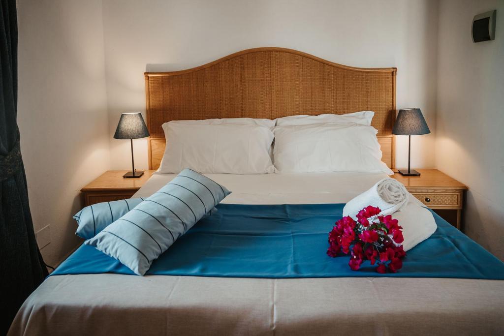 Postel nebo postele na pokoji v ubytování Hotel Rojas