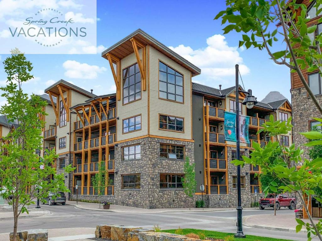 a large apartment building with a lot of windows at White Spruce Lodge by Spring Creek Vacations in Canmore