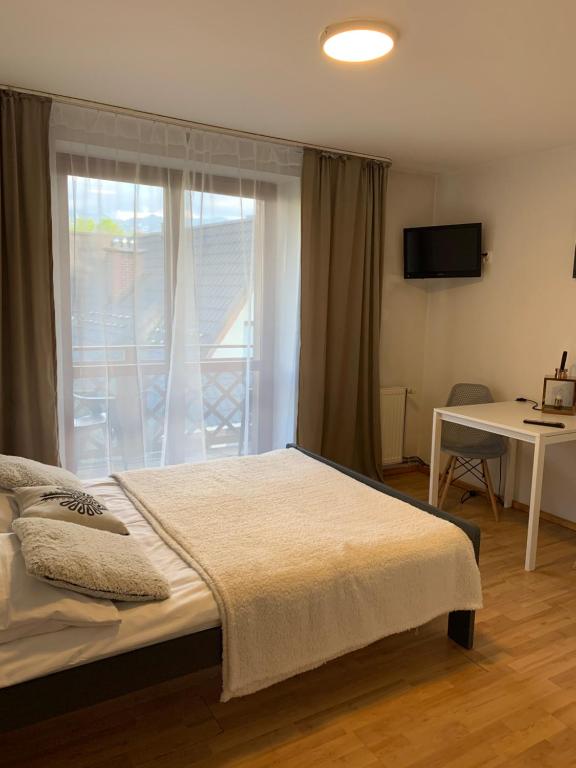Posteľ alebo postele v izbe v ubytovaní Przystanek Gubałówka -Guest House Zakopane