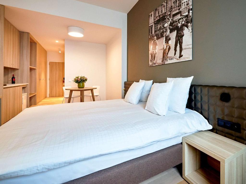 Postel nebo postele na pokoji v ubytování Mercure Roeselare