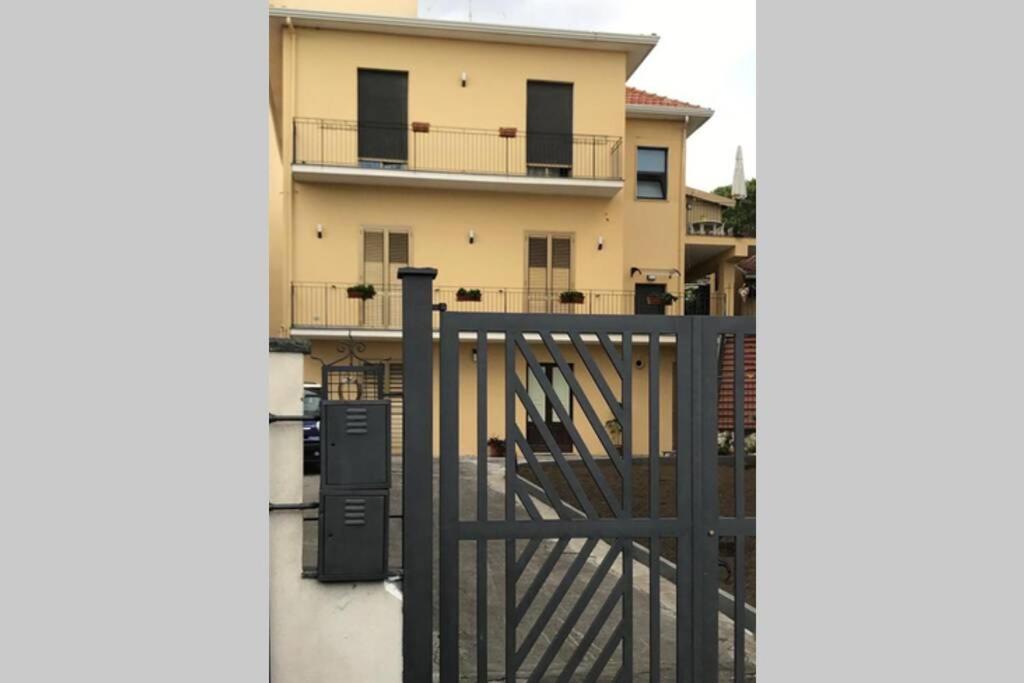 a building with a gate in front of a house at Fuoco dell’Etna in Nicolosi