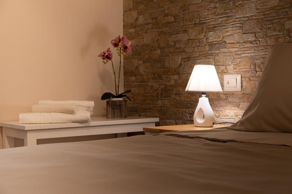 Łóżko lub łóżka w pokoju w obiekcie Tizzy Apartment & Rooms