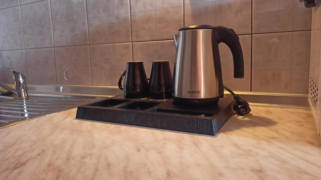 a coffeemaker sitting on top of a kitchen counter at House Chrysoula Mitsokopi in Sarti