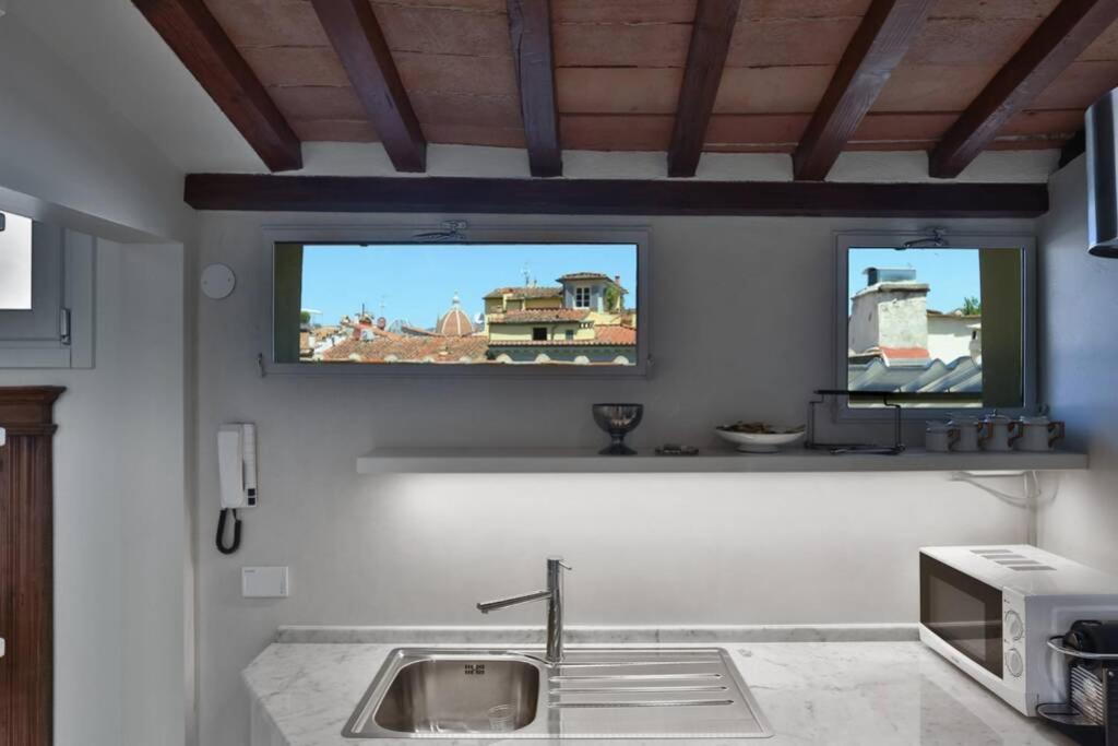 Televízia a/alebo spoločenská miestnosť v ubytovaní Niccolò Terrace