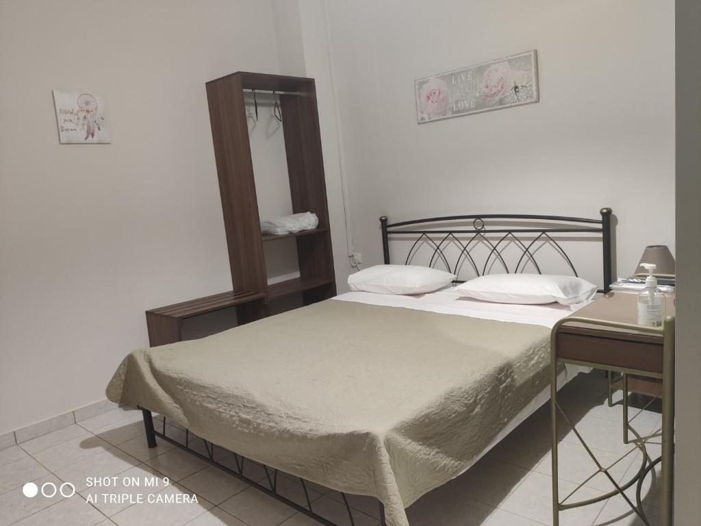 Posteľ alebo postele v izbe v ubytovaní Hotel Trifylia