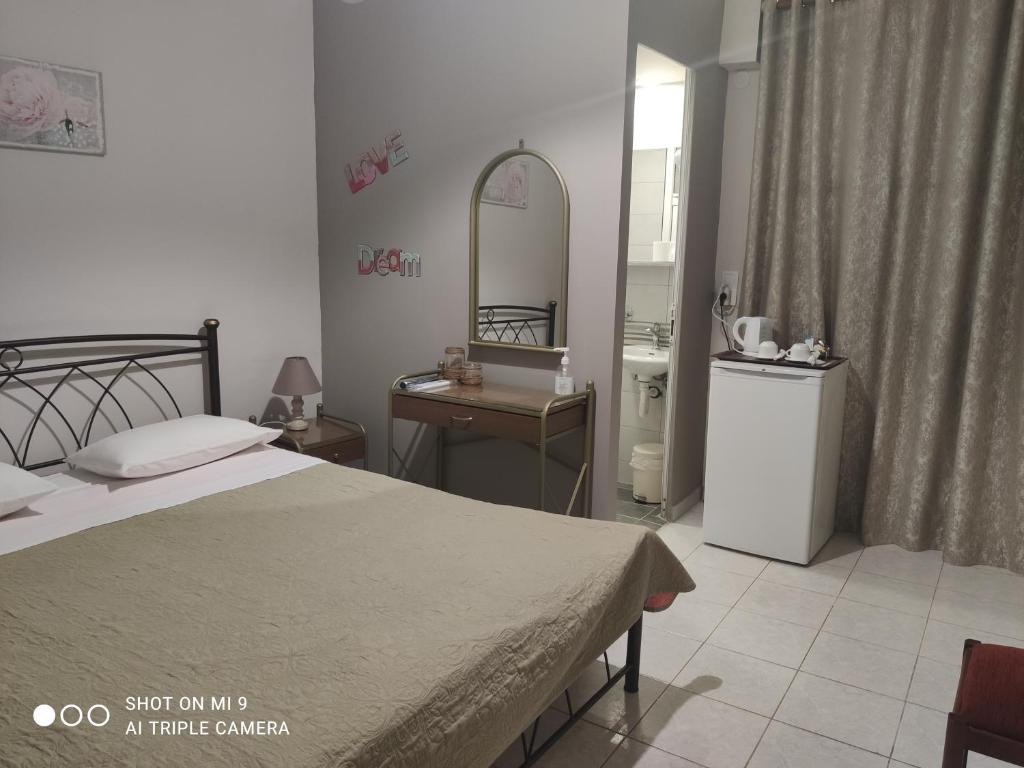 Posteľ alebo postele v izbe v ubytovaní Hotel Trifylia