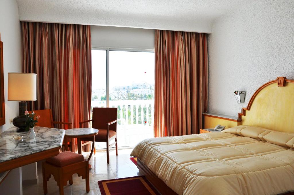 Postel nebo postele na pokoji v ubytování Kanta Resort and Spa
