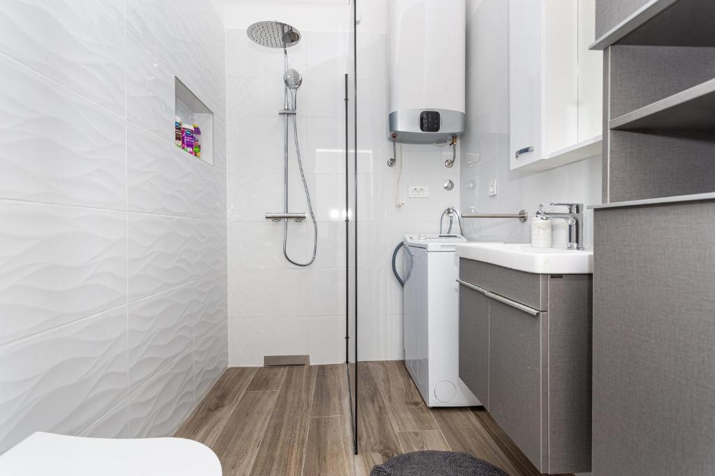Kuchyň nebo kuchyňský kout v ubytování Apartments Doris