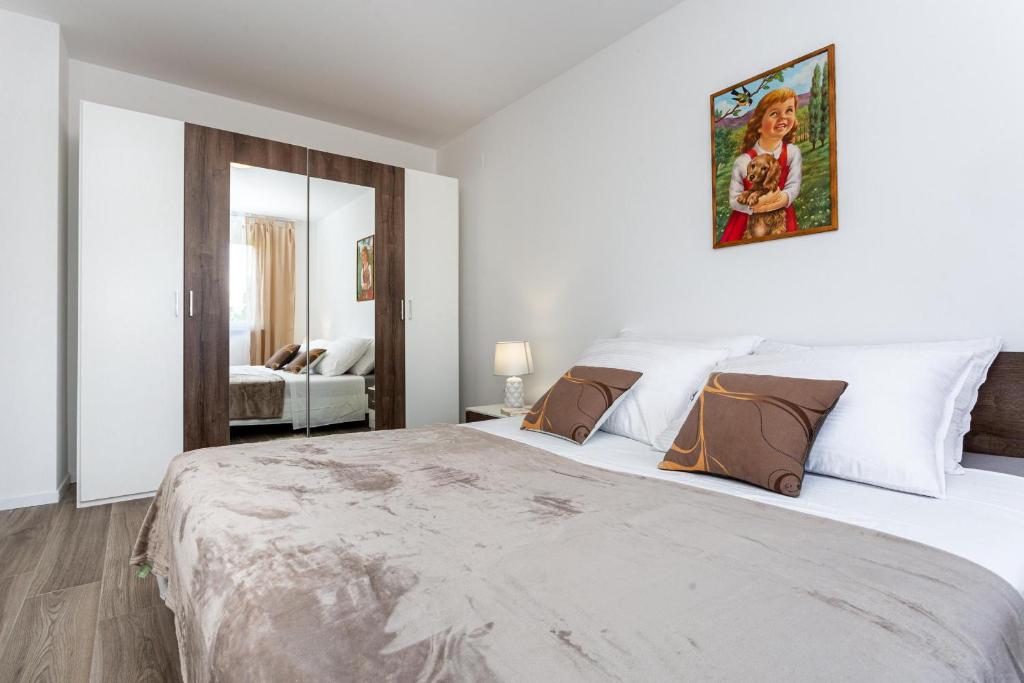 Postel nebo postele na pokoji v ubytování Apartments Doris