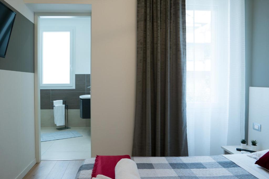 Postel nebo postele na pokoji v ubytování Venice Rooms