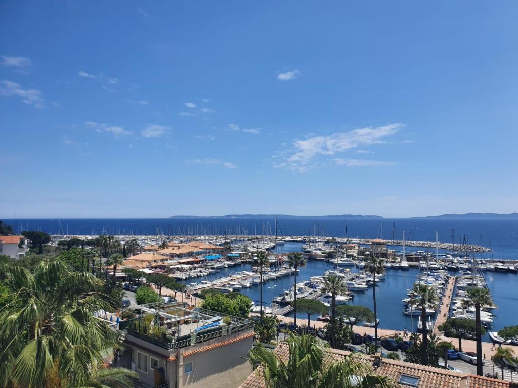 a view of a marina with boats in the water at Vue mer exceptionnelle in Le Lavandou