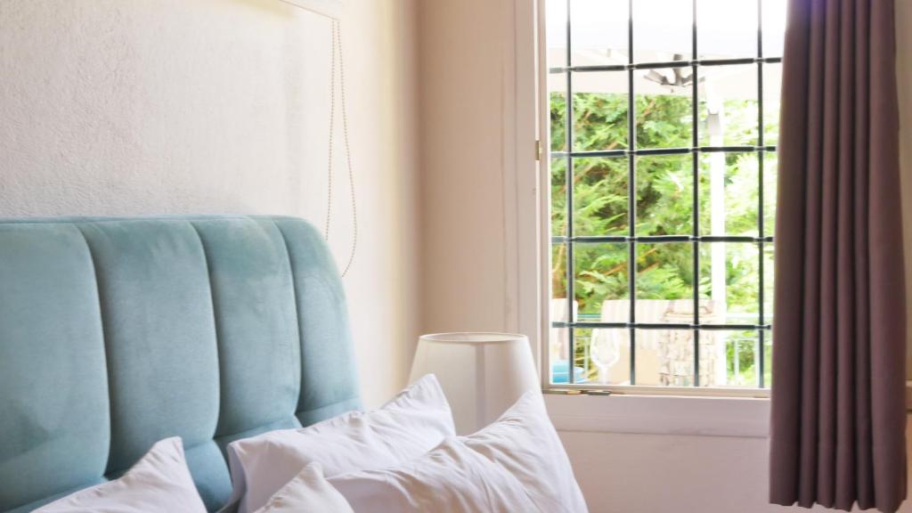 Posteľ alebo postele v izbe v ubytovaní Villa Victoria Boutique Apartments