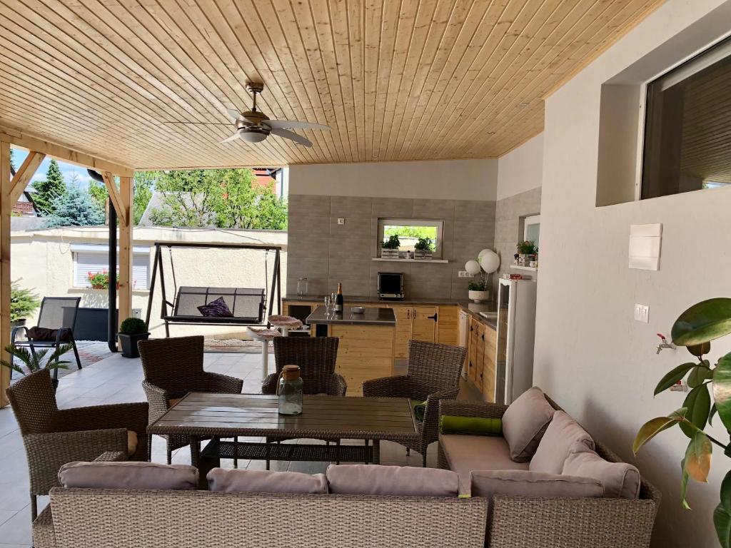 a living room with a couch and a table at PèterTünde Vendèghàz in Keszthely