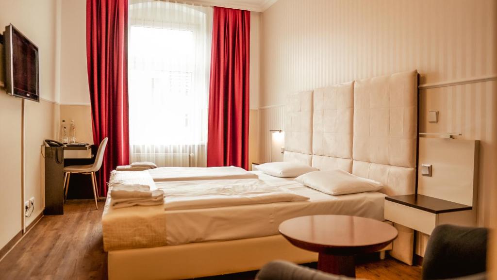 Postel nebo postele na pokoji v ubytování Hotel Prens Berlin