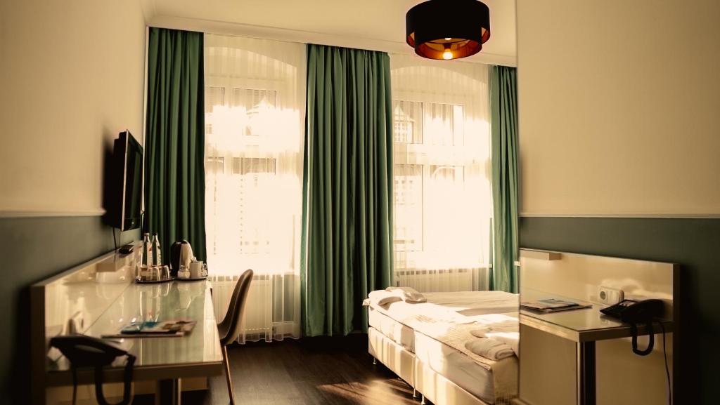 TV a/nebo společenská místnost v ubytování Hotel Prens Berlin