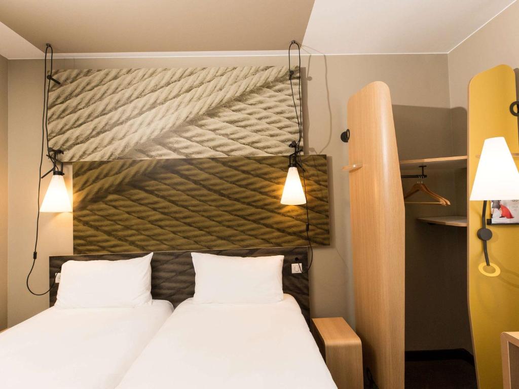 Postel nebo postele na pokoji v ubytování ibis Vilnius Centre