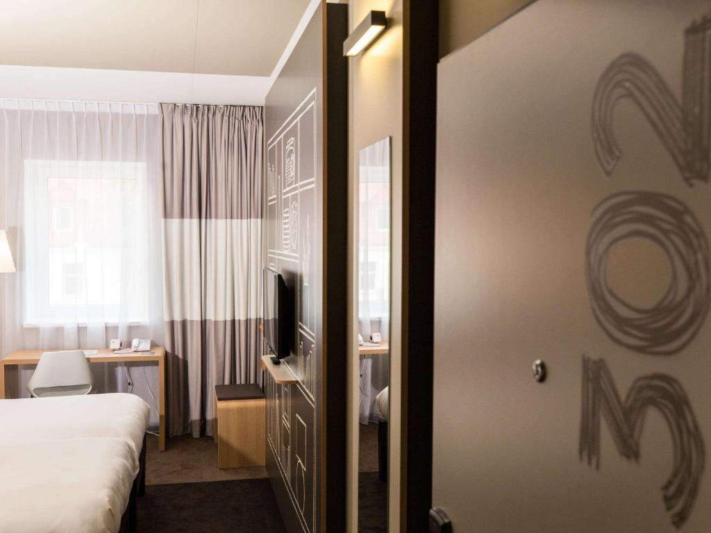Postel nebo postele na pokoji v ubytování ibis Vilnius Centre