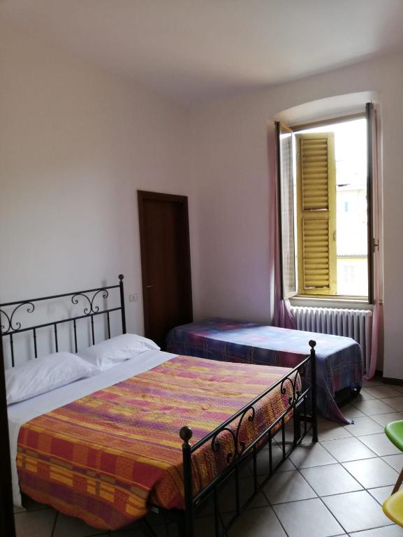 A bed or beds in a room at B&B Smeraldo Airport