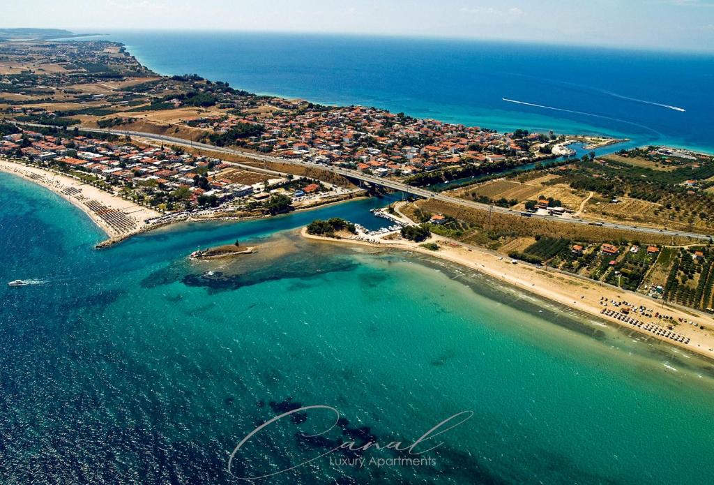 an aerial view of a beach and the ocean at Canal Luxury Apartments in Nea Potidaea
