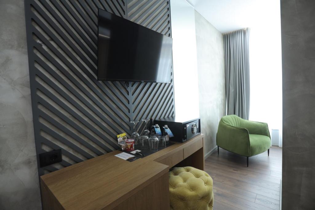 TV a/nebo společenská místnost v ubytování AP Hotel Boutique