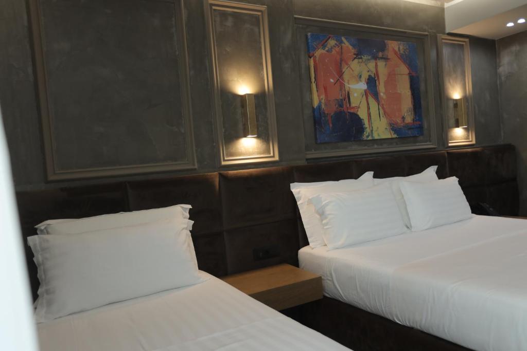 Postel nebo postele na pokoji v ubytování AP Hotel Boutique