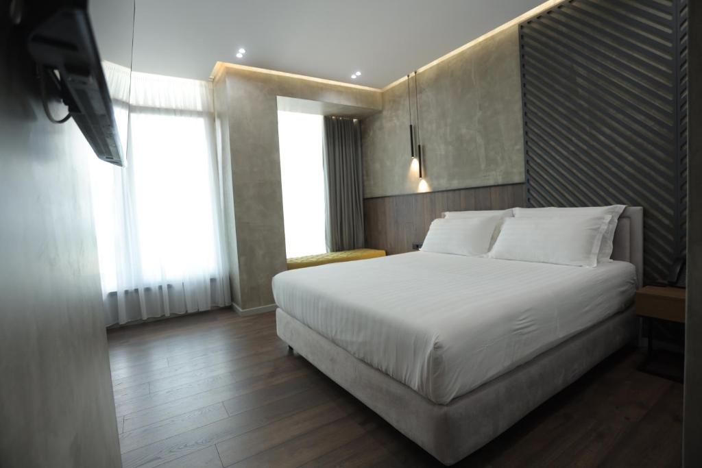 Postel nebo postele na pokoji v ubytování AP Hotel Boutique