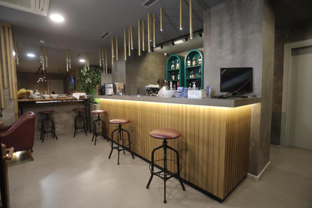 TV a/nebo společenská místnost v ubytování AP Hotel Boutique