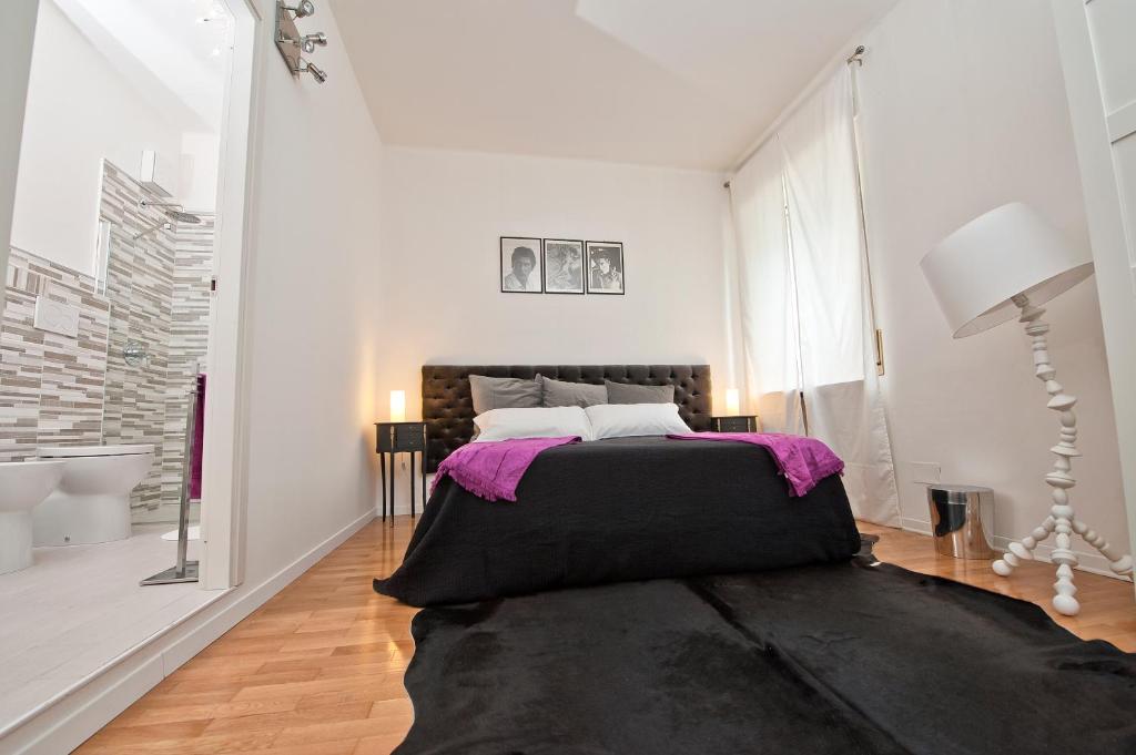 Postel nebo postele na pokoji v ubytování Verona Maison