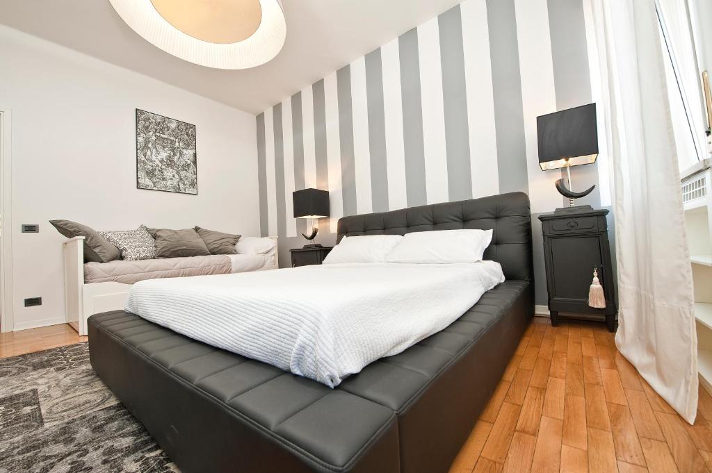 Postel nebo postele na pokoji v ubytování Verona Maison