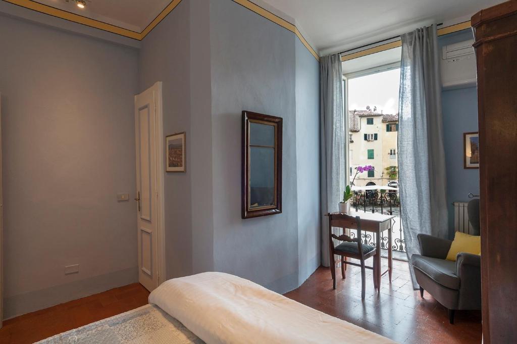 Posteľ alebo postele v izbe v ubytovaní B&B Arena di Lucca