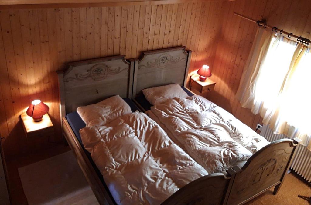 Postel nebo postele na pokoji v ubytování Breitmoos