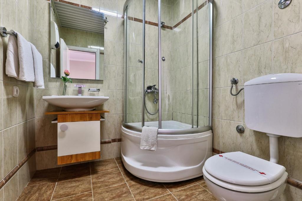 Koupelna v ubytování Apartments Misko