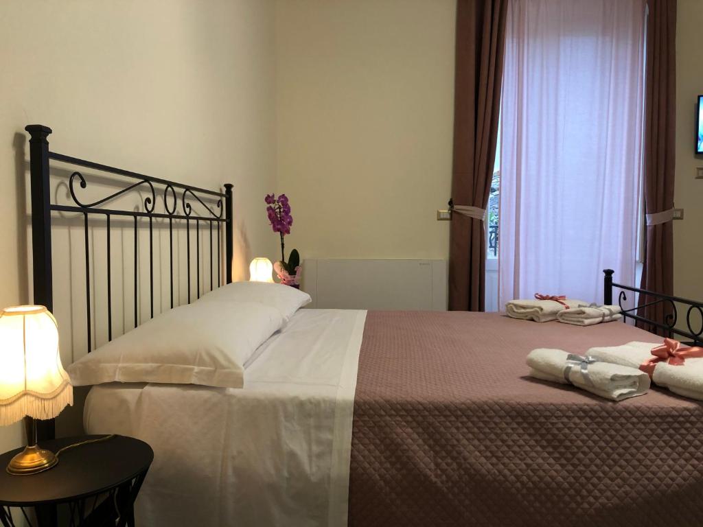 Łóżko lub łóżka w pokoju w obiekcie Domus Aurea