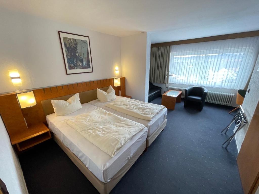 Postel nebo postele na pokoji v ubytování Hotel Martina