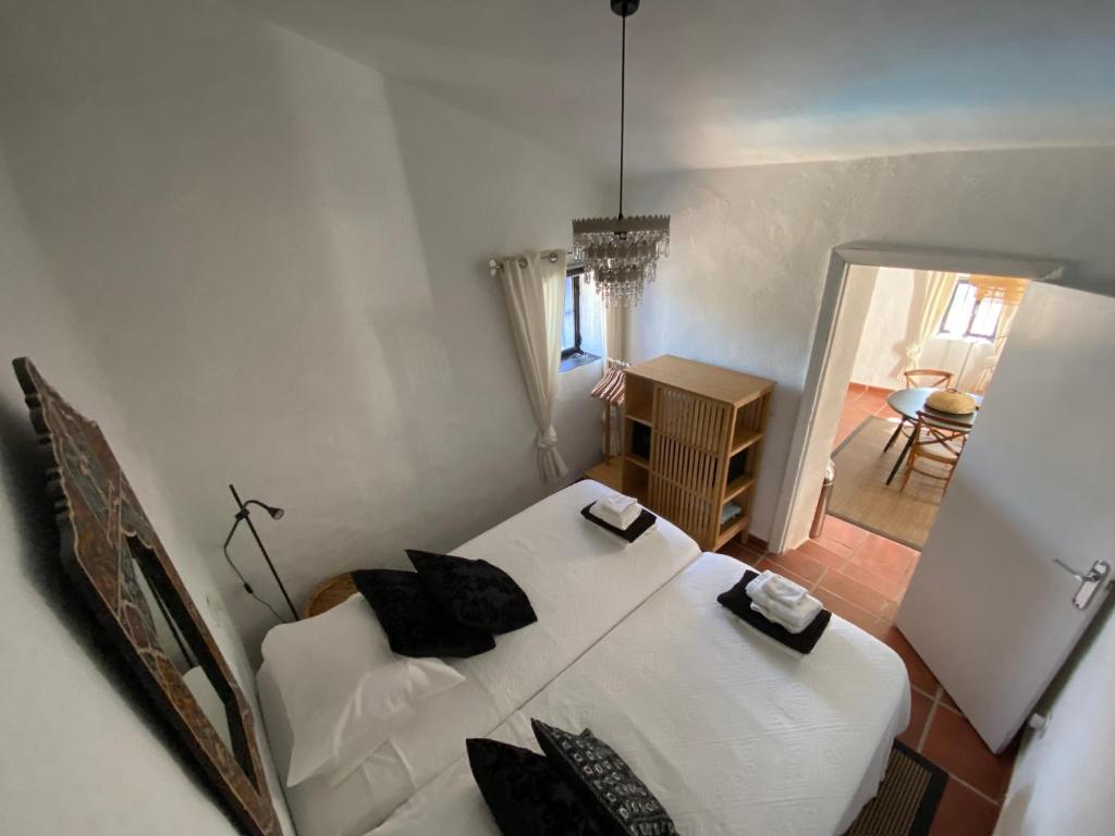 מיטה או מיטות בחדר ב-Casa Junius