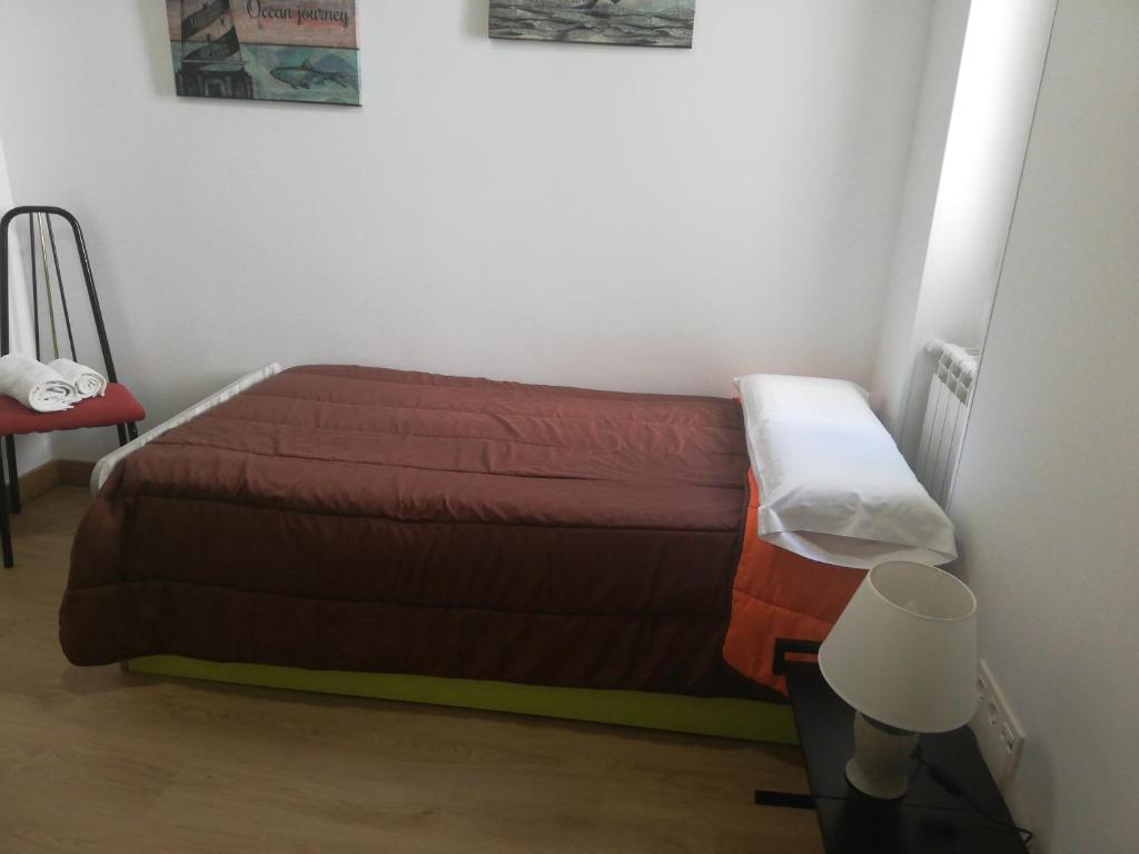 A bed or beds in a room at Alba Renueva 6