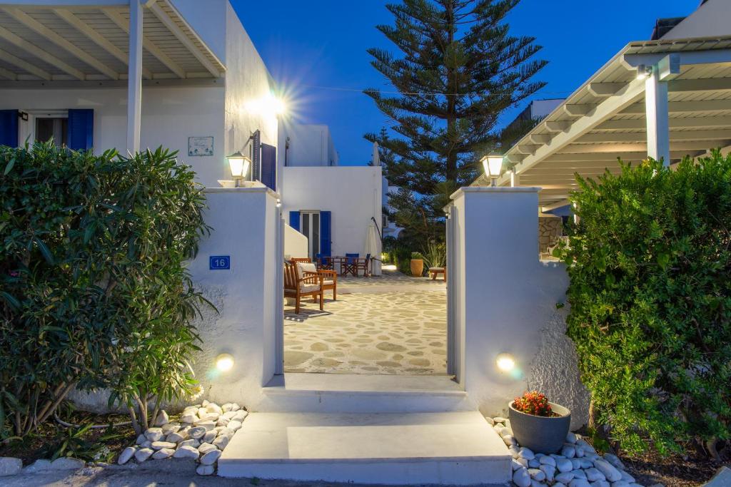 a pathway leading to a villa at night at Marioly Studios in Parikia