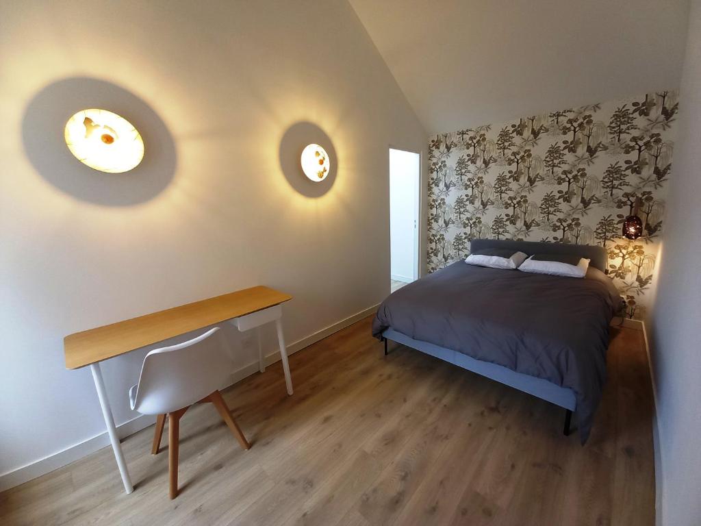 Ένα ή περισσότερα κρεβάτια σε δωμάτιο στο HISTOIRE DE LOIRE - La Maison