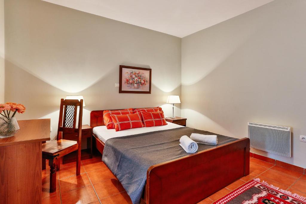 Postel nebo postele na pokoji v ubytování Apartments Misko